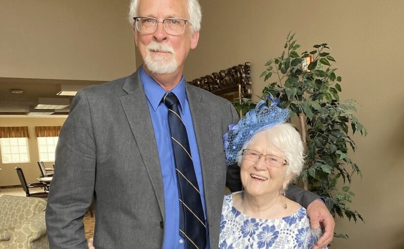 Mark and Greta dressed formally and standing side by side