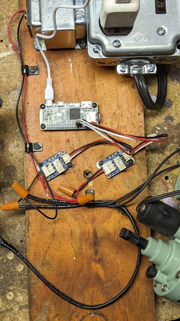 A jumble of electronics on a wood board