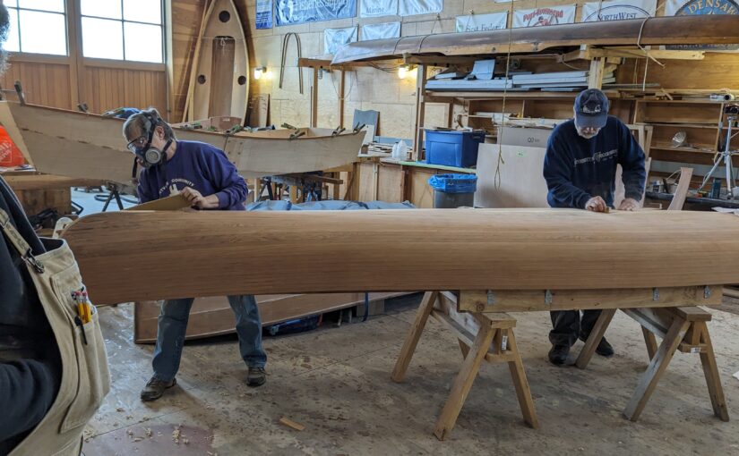 Janell and Rich working on a canoe